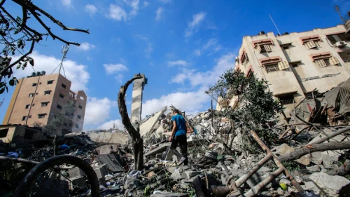 Palestinians check the damage after an Israeli airstrike in Gaza City, on May 18, 2021. Photo by Atia Mohammed/Flash90.