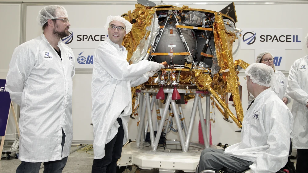 Israeli engineers place the time capsule into the spacecraft on Dec. 18, 2018. Credit: IAI.