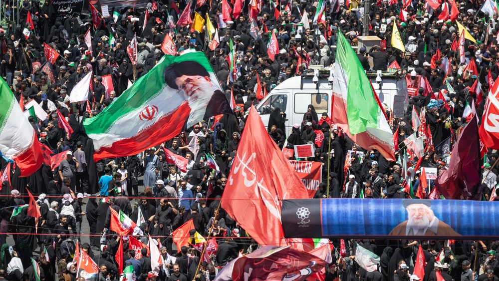 Iranian mourners in Mashhad await the arrival of the body of slain Supreme Leader Ali Khamenei, July 9, 2026. Photo by John Moore/Getty Images.
