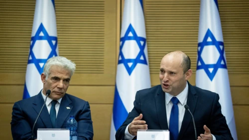Israeli Prime Minister Naftali Bennett (right) and Foreign Minister Yair Lapid attend a Knesset meeting on June 13, 2021. Photo by Yonatan Sindel/Flash90.