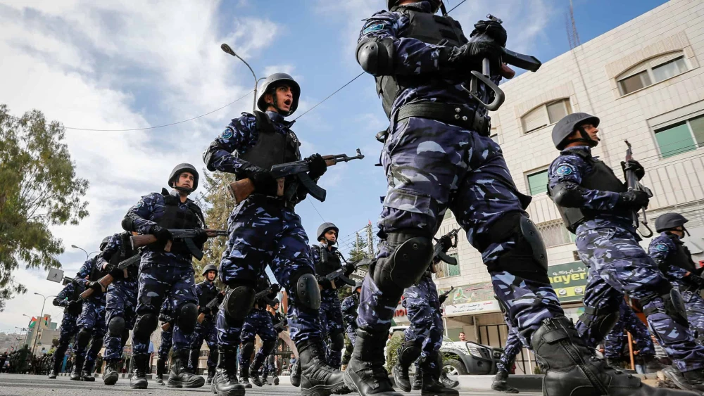 Palestinian Authority security personnel parade in the Judea city of Hebron, Nov. 14, 2017. Photo by Wisam Hashlamoun/Flash90.