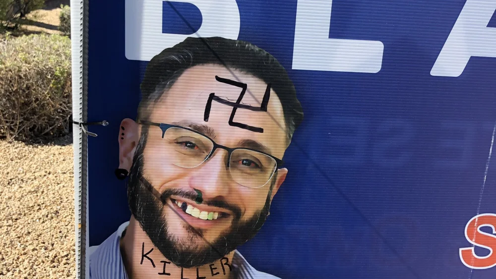 A campaign sign for Seth Blattman, a Jewish Democratic candidate running for Arizona Senate, was vandalized with anti-Semitic graffiti, October 2020. Source: Seth Blattman/Twitter.