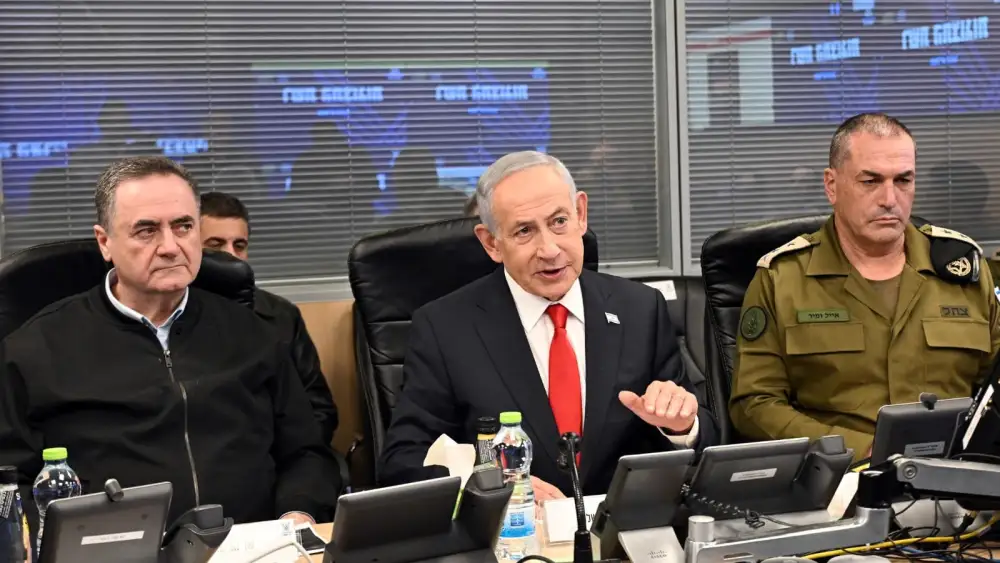 Israeli Prime Minister Benjamin Netanyahu, flanked by Defense Minister Israel Katz and Chief of Staff Lt. Gen. Eyal Zamir, conveys a message to the Iranian people from the Israeli Air Force command center, March 17, 2026. Credit: Haim Zach/GPO.