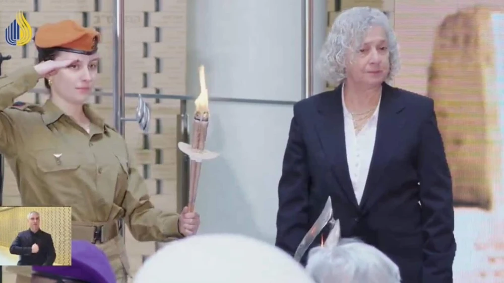 Dalia Mizrahi, l., lit the memorial candle at The State Memorial Ceremony for Fallen Soldiers Whose Burial Place is Unknown in Jerusalem, Feb. 24, 2026. Credit: YouTube/MoD.