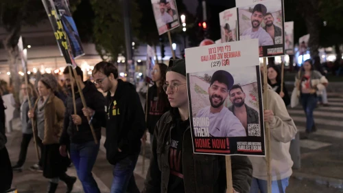 Family, friends and activists hold posters of Israeli brothers Gili and Ziv Berman, who are being held hostage by Hamas terrorists in Gaza, during a protest march for their release in Tel Aviv, Jan. 9, 2025. Photo by Tomer Neuberg/Flash90.