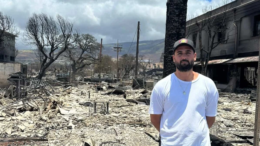 Ido Sarfati stands outside the remains of his businesses that were destroyed by wildfires last week that swept through Lahaina on the island of Maui, Aug. 14, 2023. Photo courtesy of Ido Sarfati.