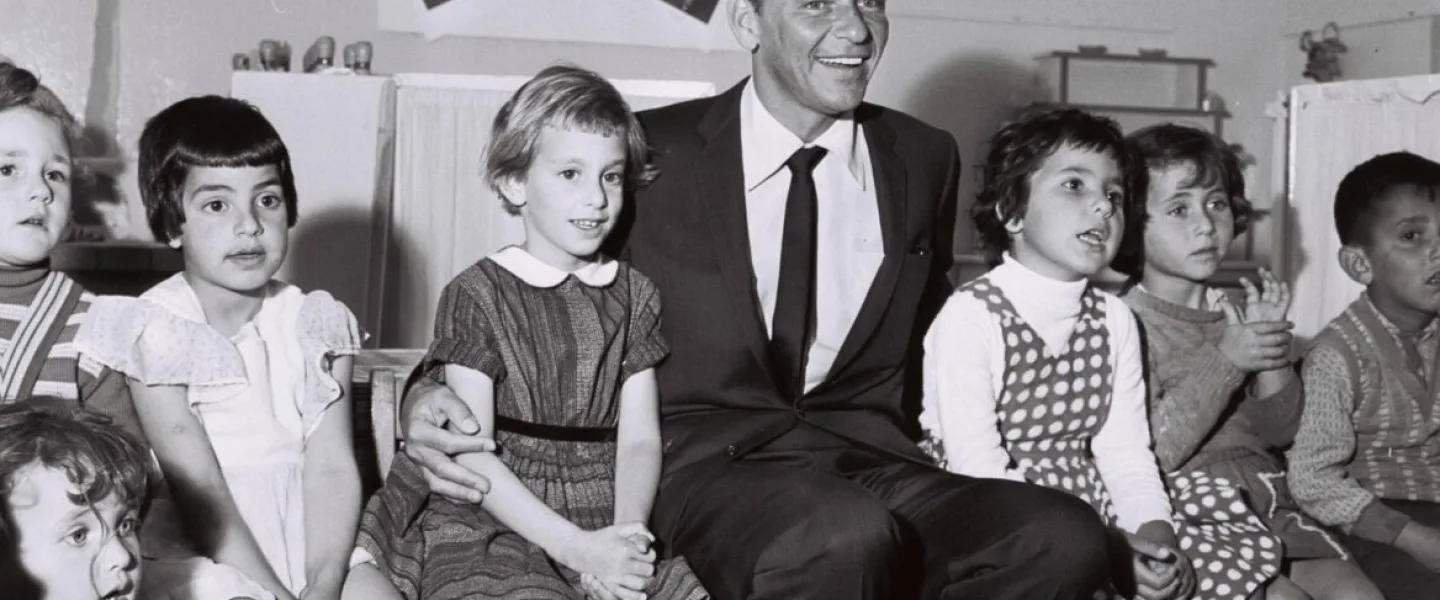 Frank Sinatra visiting a kindergarten in Nazareth Illit, 1962. Credit: GPO.