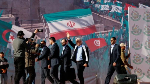 Yahya Sinwar (waving, with white scarf), leader of Hamas in the Gaza Strip, at a rally in Gaza marking the terrorist group's 35th anniversary, Dec. 14, 2022. Photo by Atia Mohammed/Flash90.