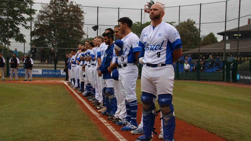 Players for Team Israel stand for the national anthem during a game in the European Championships. Photo by Margo Sugarman.