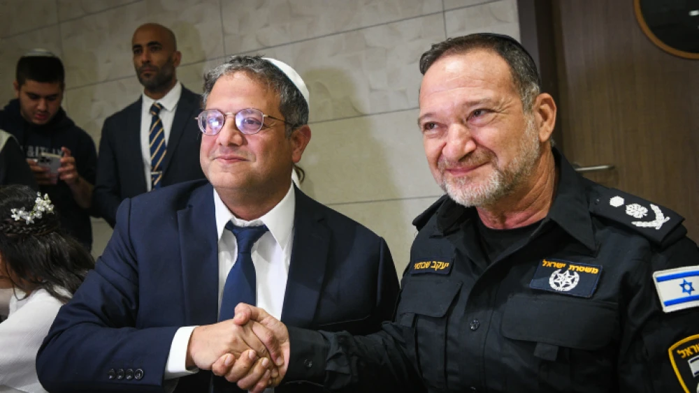 Otzma Yehudit Party head MK Itamar Ben-Gvir and Israel Police Commissioner Yaakov Shabtai at Ben-Gvir's daughter's bat mitzvah in Kiryat Arba, Dec. 8, 2022. Photo by Arie Leib Abrams/Flash90.