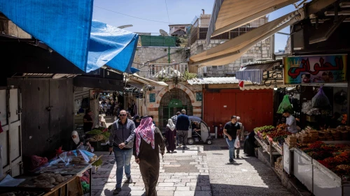 An Arab man walks through the Old City of Jerusalem, the evening before the start of the Jewish holiday of Passover. April 21, 2024. Photo by Chaim Goldberg/Flash90.