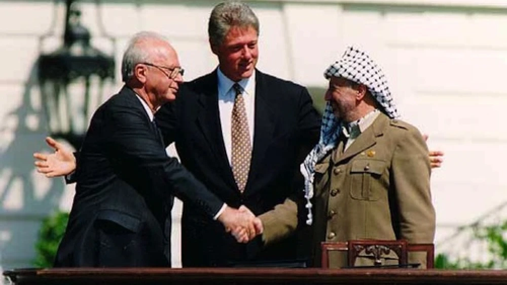 From left: Israeli Prime Minister Yitzhak Rabin, U.S. President Bill Clinton and Palestine Liberation Organization head Yasser Arafat at the signing of the Oslo Accords on Sept. 13, 1993. Credit: Vince Musi/The White House.