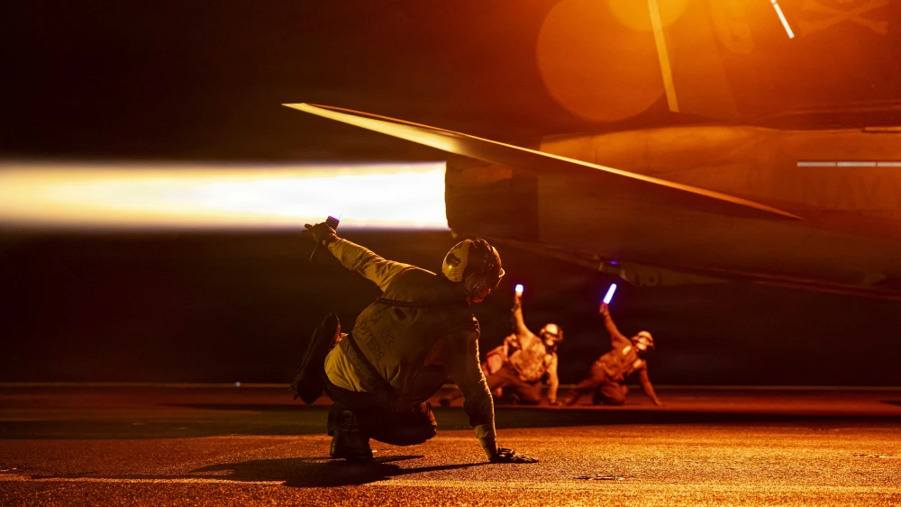 U.S. sailors conduct night flight operations aboard the aircraft carrier USS George H.W. Bush, July 29, 2026. The carrier is deployed to the U.S. 5th Fleet area of operations to support maritime security and stability in the Middle East. U.S. Navy photo.