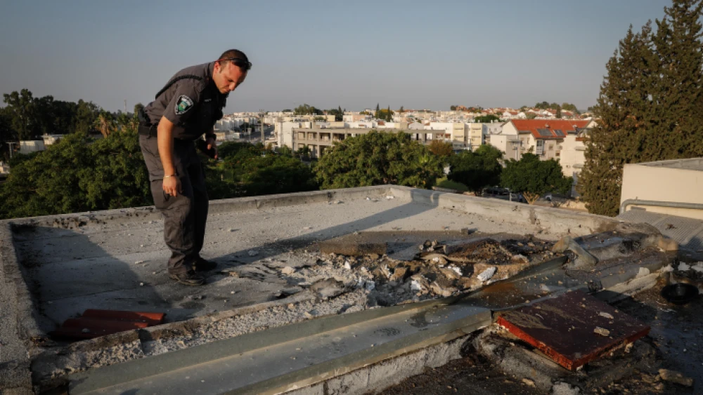 File photo: View of the damage caused by a rocket that hit a rooftop of a building in the southern Israeli city of Sderot on July 14, 2018. Photo by Hadas Parush/Flash90.