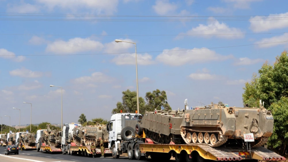 A military convoy carrying APCs near Israel's border with the Gaza Strip, July 19, 2014. Photo by Gili Yaari /Flash90.