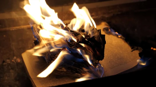 An open book on fire. Credit: Sergeyxsp/Shutterstock.