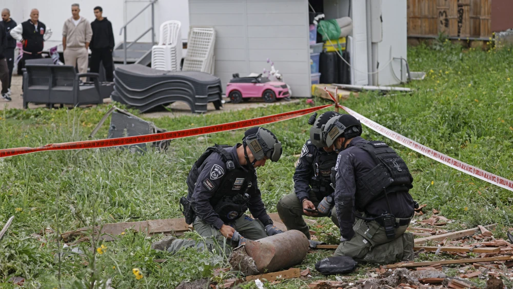 Israeli security forces gather at the site of a Hezbollah missile strike that targeted a house in the northern Israeli town of Kiryat Shmona near the border with Lebanon on April 1, 2026. Photo by Jalaa Marey / AFP via Getty Images.