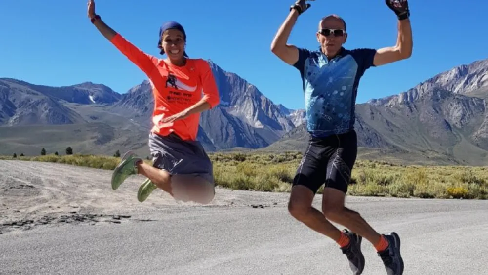 Beatie Deutsch kicks up her heels at Mammoth Lakes Altitude training camp in August 2019 with her coach, Amit Ne’eman. Photo courtesy of Beatie Deutsch.