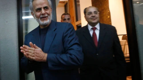 Ra'am-Ta'al Party members Ibrahim Sarsur (left) and Ahmad Tibi arrive at a press conference after meeting with the Israeli President Shimon Peres at the President's Residence in Jerusalem on Jan. 31, 2013. Photo by Miriam Alster/Flash90.