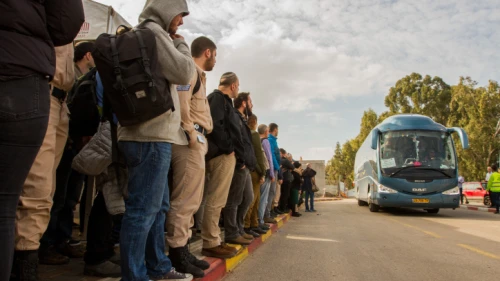 Passengers wait for shuttles to Tel Aviv at the Beit Yehoshua train station, Feb. 19, 2018. Photo by Flash90.