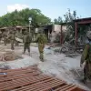 Israeli soldiers in Kfar Aza, a kibbutz near the Israeli-Gaza border, on Oct. 15, 2023. Photo by Edi Israel/Flash90.