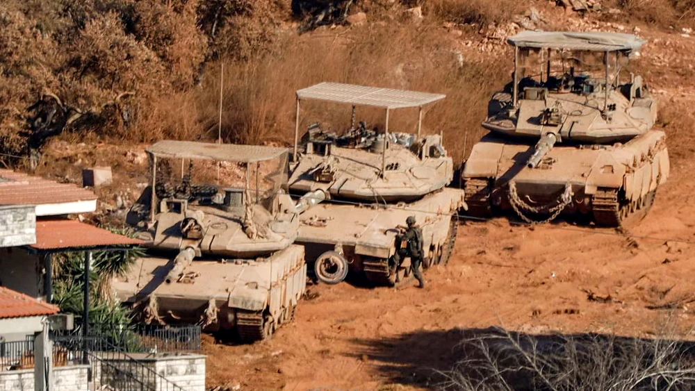 Israeli battle tanks deploy in the Southern Lebanese village of Zawtar al-Sharqiyah, as seen from nearby Zawtar al-Gharbiyah, on Aug. 2, 2026. Photo by Ammar Ammar / AFP via Getty Images.