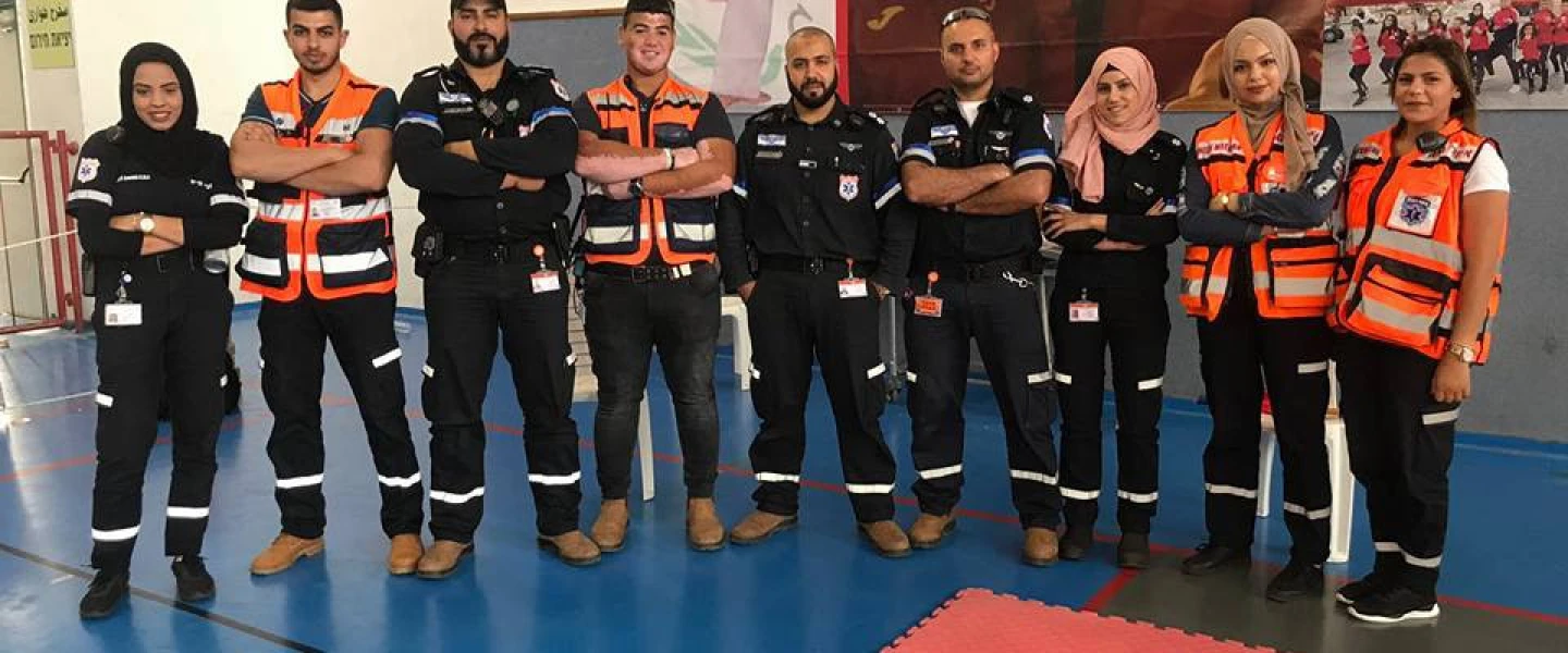 Muslim volunteers of United Hatzalah and the local ambulance team of Kfar Kara pose together after a training session. Sanaa Mahameed is third from right. Credit: United Hatzalah.