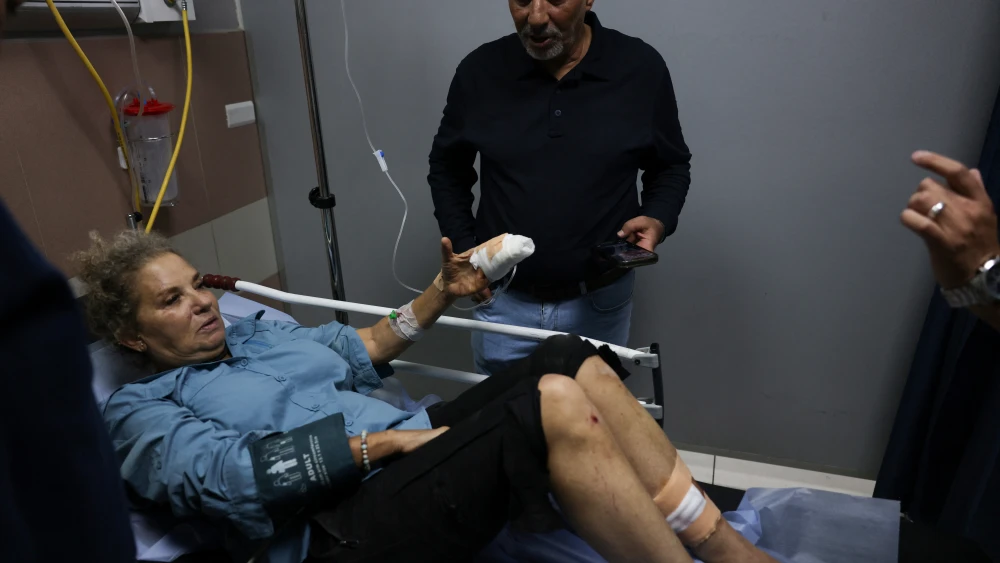 “Washington Post” photojournalist Heidi Levine lies on a gurney in the emergency room of a hospital in Ramallah after she was injured in a confrontation near the village of Abu Falah in Samaria on Oct. 16, 2026. Credit: Ahmad Gharabli/AFP via Getty Images.