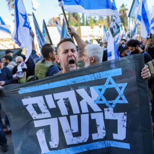 An Israel Defense Forces reservist from the Brothers in Arms protest group attends a demonstration against judicial reform in Bnei Brak, near Tel Aviv, March 16, 2023. Photo by Flash90.
