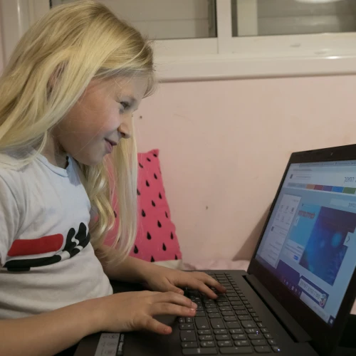 A young student learns via remote learning at her home in Moshav Haniel, Israel, on March 18, 2020. Photo by Chen Leopold/Flash90.