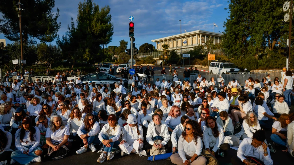 Supporters of Israelis held hostage in the Gaza Strip dress in white as they attend a silent protest outside the Knesset in Jerusalem calling for their release, Nov. 4, 2024. Photo by Chaim Goldberg/Flash90.