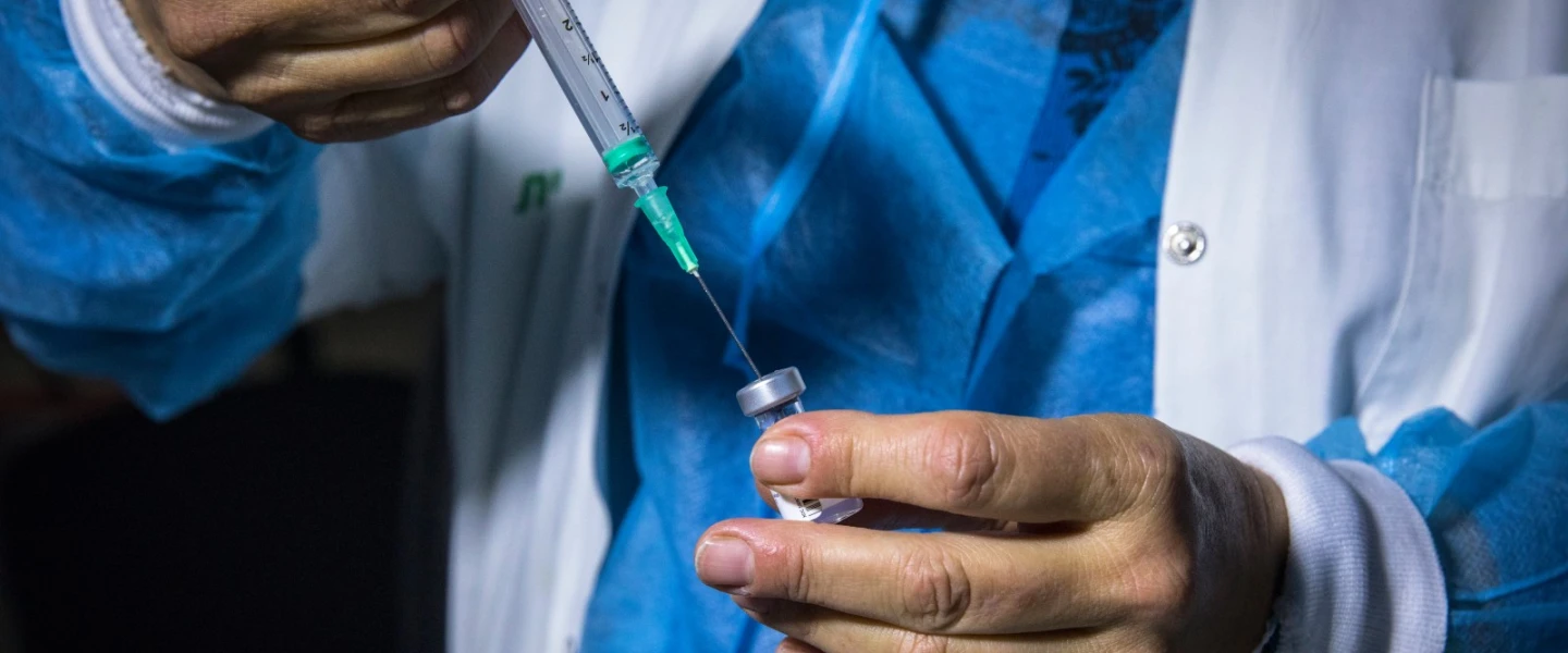 A medical professional preparing a COVID-19 vaccine in Jerusalem. Photo by Olivier Fitoussi/Flash90.