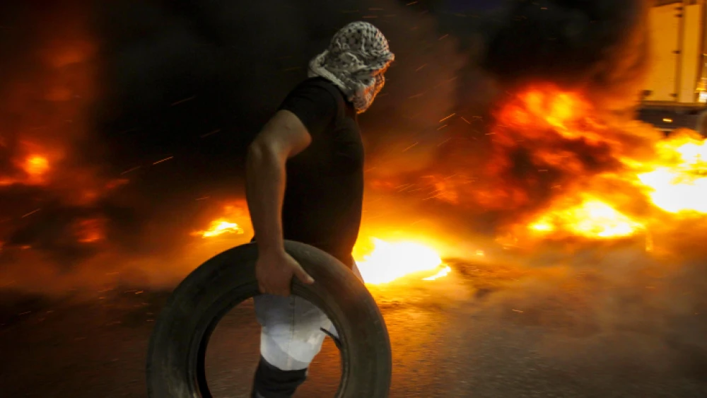 Palestinians demonstrate at the Israeli Huwara checkpoint near the city of Nablus and clash with Israeli security forces in support to the escape of the six Palestinian prisoners from the Israeli prison of Gilboa on Sept. 8, 2021. Photo by Nasser Ishtayeh/Flash90.