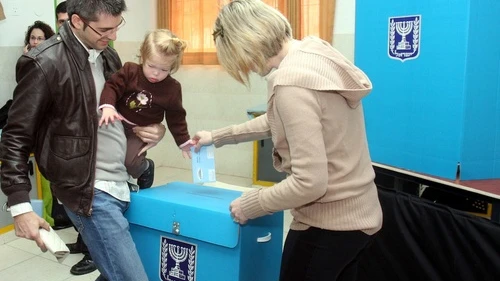 An Israeli family casts a ballot at a polling station in Tel Aviv on Feb. 10, 2009. Photo by Flash90.