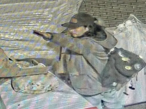 A man performs what appears to be the Nazi salute before setting on fire boxes in front of a synagogue in Giessen, Germany. Photo courtesy of EJA.