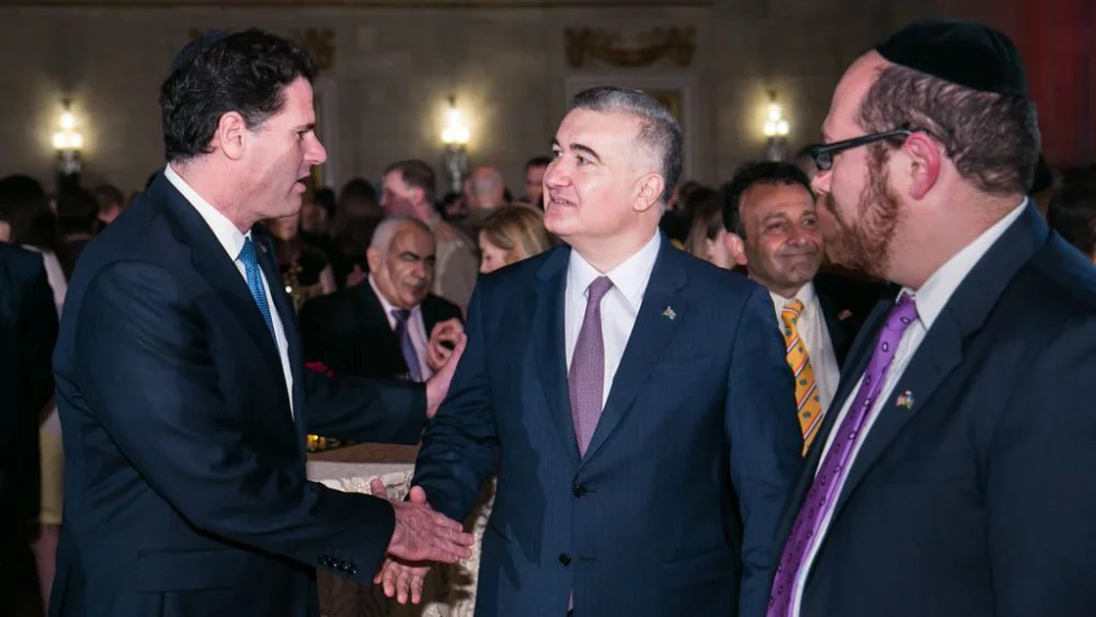 Azerbaijan's Ambassador to the U.S. Elin Suleymanov (right) shakes hands with Israel's Ambassador to the U.S. Ron Dermer (left) at an event in June 2017. Credit: Twitter.