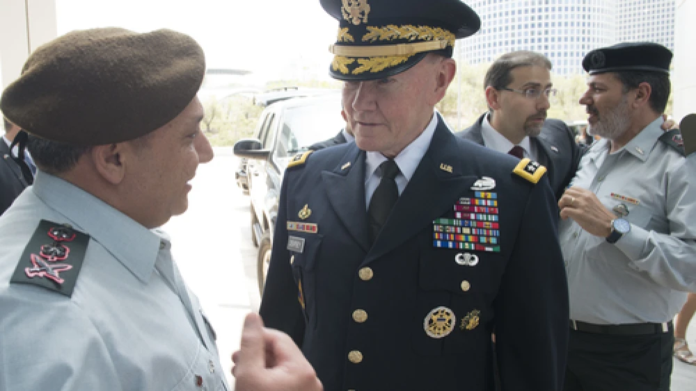 Israel Defense Forces (IDF) Chief of Staff Lt. Gen. Gadi Eizenkot (far left) speaks with Gen. Martin E. Dempsey (center), chairman of the U.S. Joint Chiefs of Staff, in Tel Aviv on June 9, 2015. Bolstering Israeli-American defense ties is among the principles mentioned in a new document released by Eizenkot on Aug. 13. The release marked the first time in 60 years that the IDF has made its official strategy publicly available. Credit: DOD photo by D. Myles Cullen/Released.
