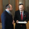 Rabbi Menachem Even-Israel, the son of Rabbi Adin Even-Israel Steinsaltz, presents the first volume of the Steinsaltz Talmud to Rep. Eliot Engel (D-N.Y.). Credit: The Aleph Society.