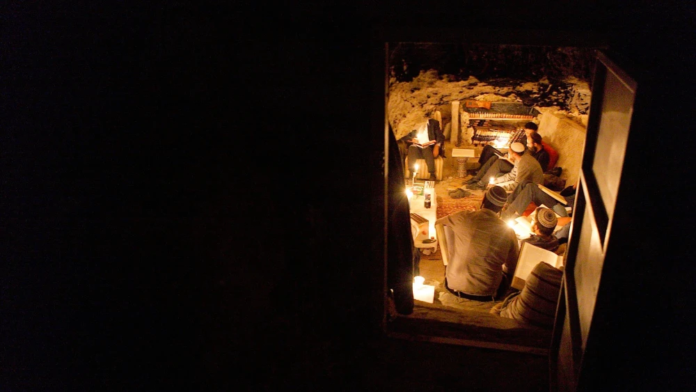 The rabbi and artist Uri Revach teaching Kabbalah classes to his students in a cave near Moshav Beim Meir, a religious moshav in central Israel, May 27, 2011. Photo by Yaakov Naumi/Flash90.
