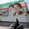 A billboard depicting the late Iranian Supreme Leader Ali Khamenei and his successor, Mojtaba Khamenei, alongside the Arabic message “Thank you, Iran,” in Beirut’s southern suburbs, June 15, 2026. Photo by Anwar Amro/AFP via Getty Images.