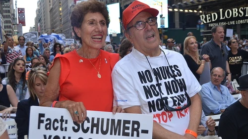 Pictured in front, Helen Freedman, director of Americans for a Safe Israel, with Charles Bernhardt at a July 22 rally against the Iran deal in New York City. The sign held by Freedman targets the vote of U.S. Sen. Chuck Schumer (D-N.Y.), who later announced he would oppose the deal. But the Senate will fall short of producing the 67 anti-deal votes needed to override a presidential veto of its collective decision. Credit: Maxine Dovere.