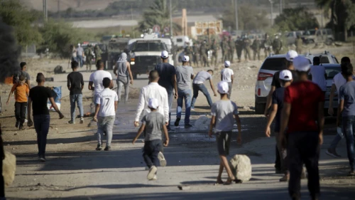 Palestinians clash with Israeli soldiers during a protest against Israel's plan to extend its sovereignty to the Jordan Valley, and parts of Judea and Samaria, June 24, 2020. Photo by Nasser Ishtayeh/Flash90.
