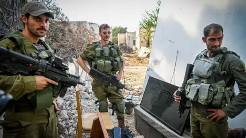 Israeli soldiers seen around the destruction caused by Hamas terrorists on Oct. 7, 2023 in Kibbutz Kfar Aza, Nov. 2, 2023. Photo by Arie Leib Abrams/Flash90.
