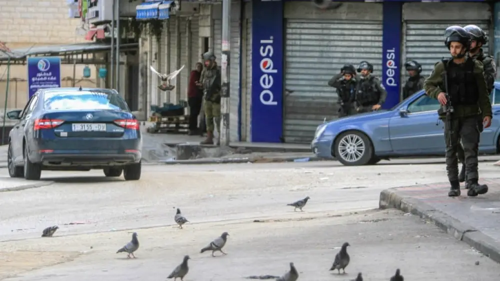 Israeli security forces stand guard in Hawara, Samaria, March 20, 2023. Photo by Nasser Ishtayeh/Flash90.