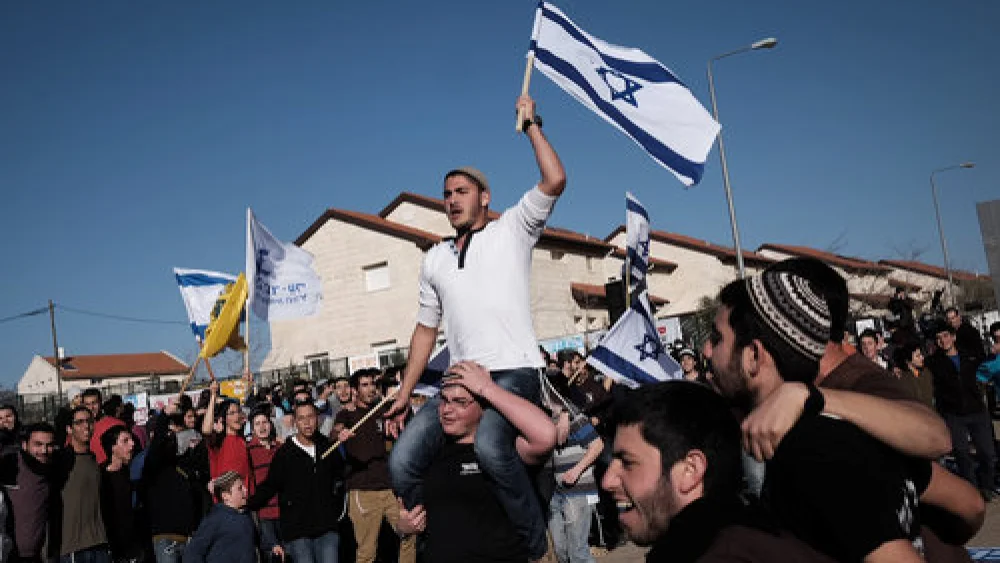 A demonstration against the planned demolition of nine homes in the Israeli settlement of Ofra, Feb. 5, 2017. Credit: Tomer Neuberg/Flash90.