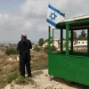 An Israeli security guard at his post at the Bat Ain settlement in Gush Etzion. Credit: Nati Shohat/Flash90.