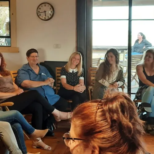 Participants of the kibbutz female leadership program meet with the Kibbutz Movement’s Secretary-General Nir Meir (in blue). Credit: Hilit Ben Zvi.