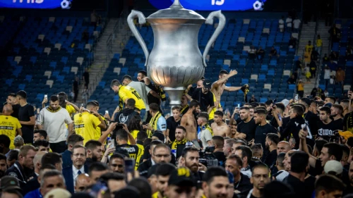 Beitar Jerusalem fans storm the field after the club's victory over Maccabi Netanya to take the Israel State Cup at the Sammy Ofer Stadium in Haifa, May 23, 2023. Photo by Oren Ben Hakoon/Flash90.