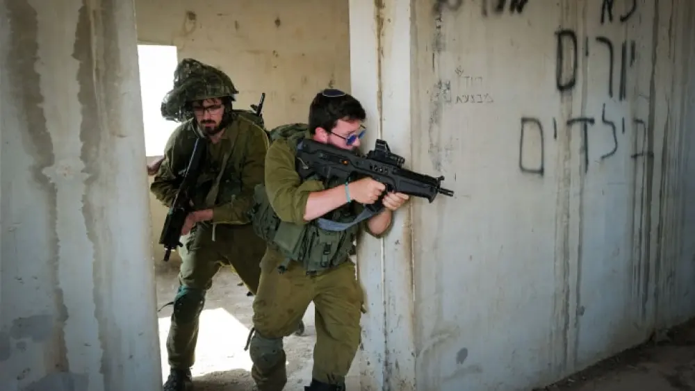 Israeli reserve soldiers train on urban warfare near Kibbutz Merom Golan in the northern Golan Heights ahead of a probable ground incursion into the Gaza Strip, Oct. 9, 2023. Photo by Michael Giladi/Flash90.