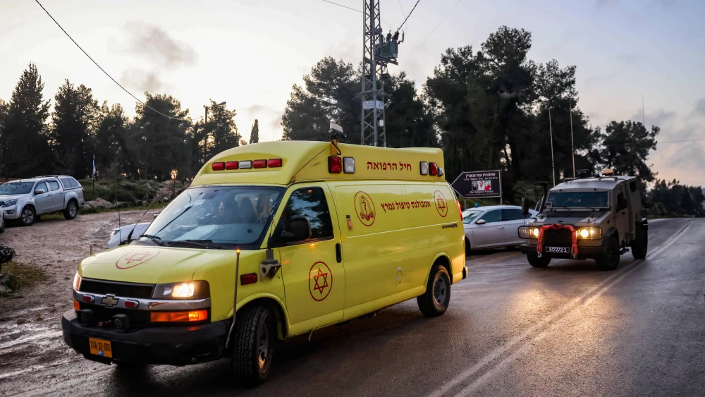 Medical and security personnel at the scene of a terrorist shooting at the Oz veGaon Nature Reserve in Judea, March 19, 2024. Photo by Chaim Goldberg/Flash90.